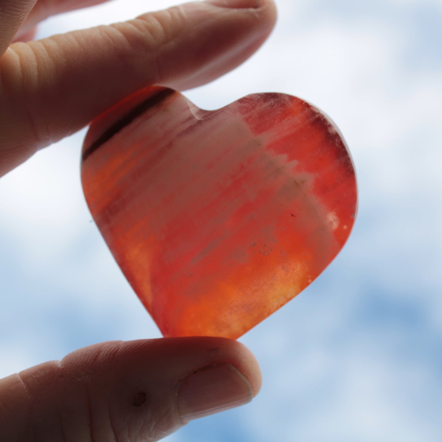 Orange Calcite hand-carved heart 57g Rocks and Things