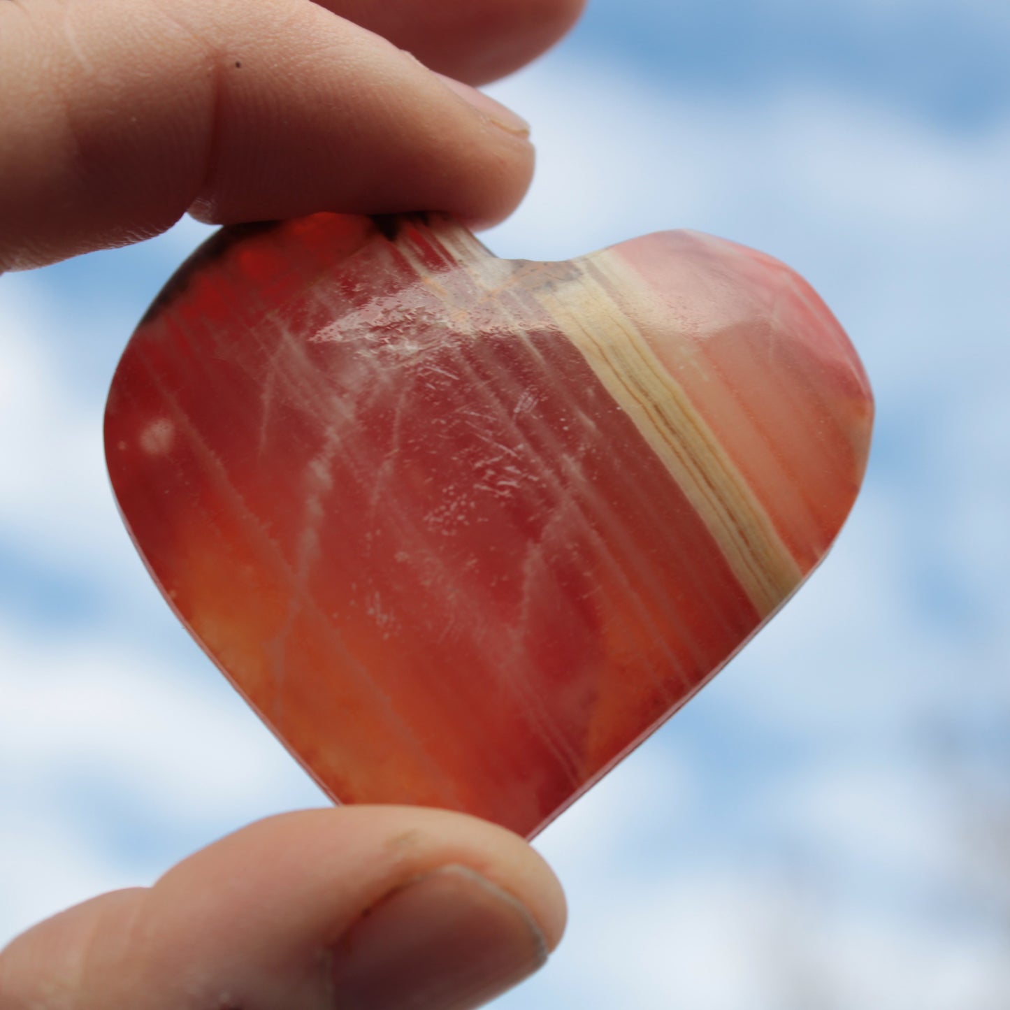 Orange Calcite hand-carved heart 57g Rocks and Things