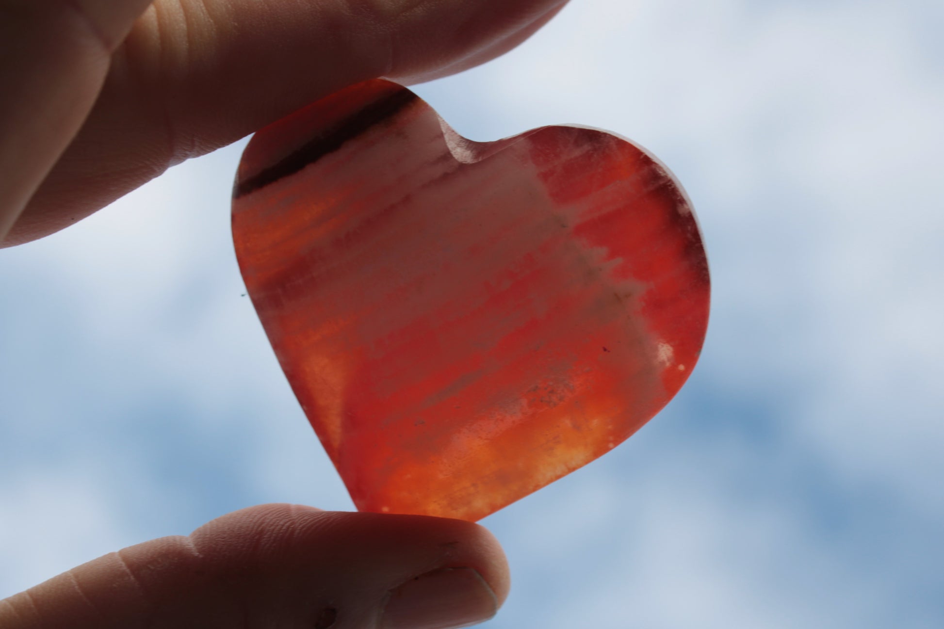 Orange Calcite hand-carved heart 57g Rocks and Things