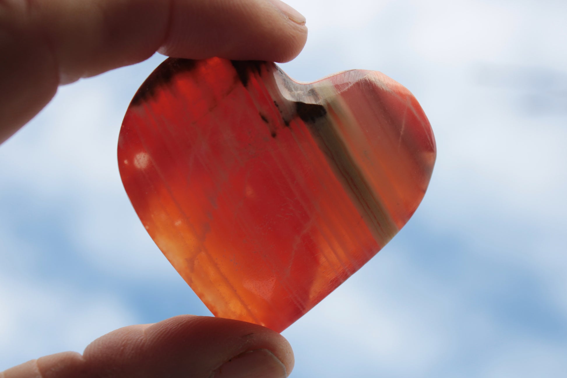 Orange Calcite hand-carved heart 57g Rocks and Things