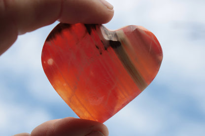 Orange Calcite hand-carved heart 57g Rocks and Things