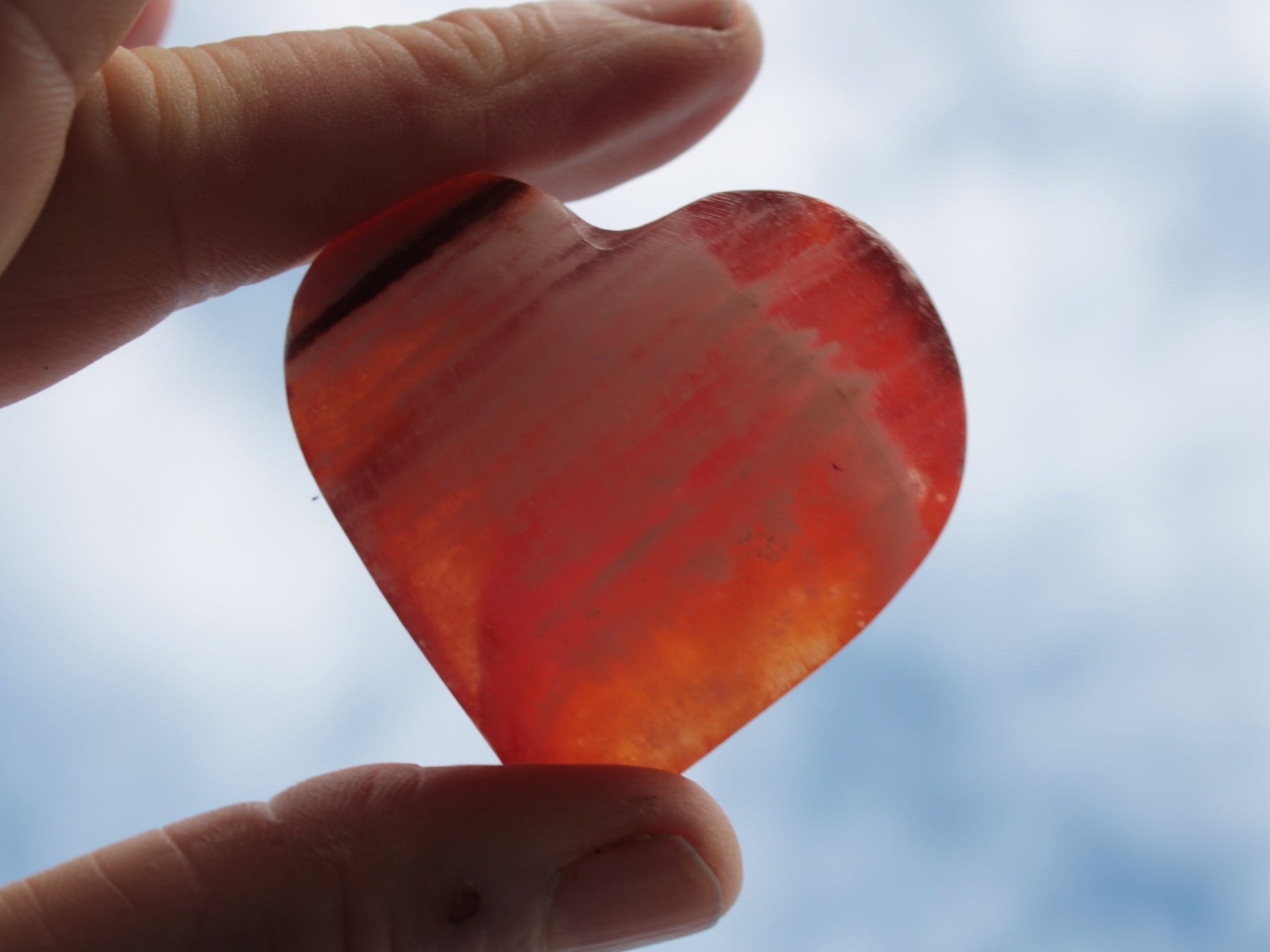 Orange Calcite hand-carved heart 57g Rocks and Things