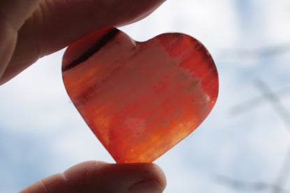 Orange Calcite hand-carved heart 57g Rocks and Things