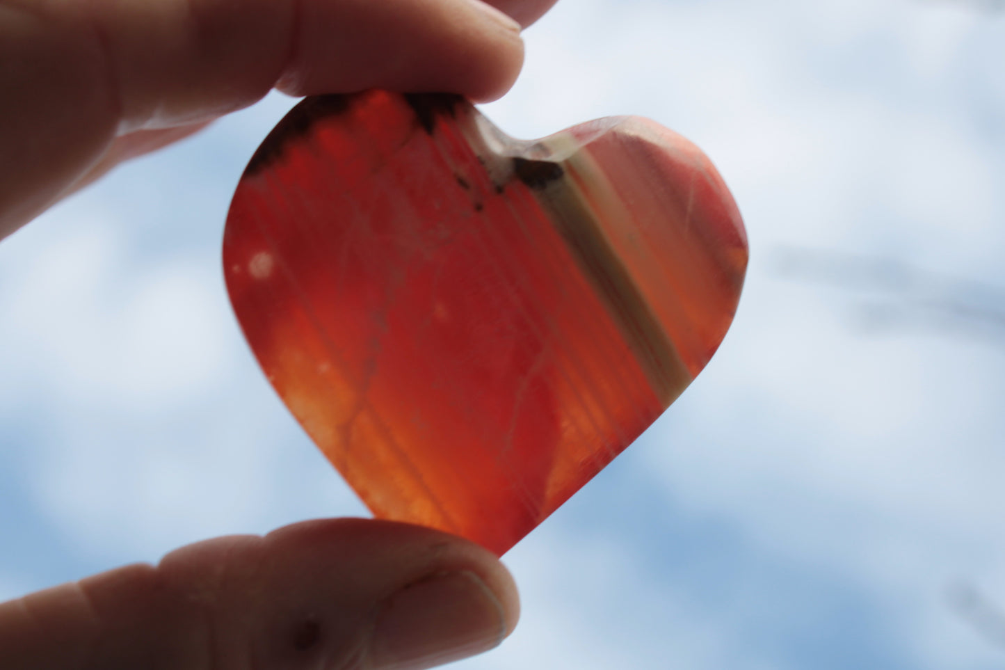 Orange Calcite hand-carved heart 57g Rocks and Things