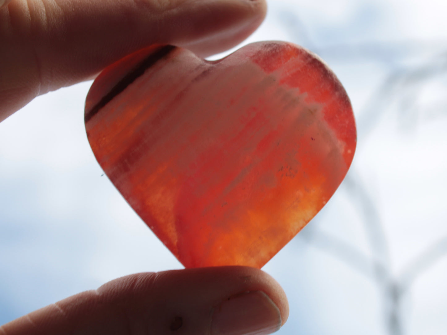 Orange Calcite hand-carved heart 57g Rocks and Things