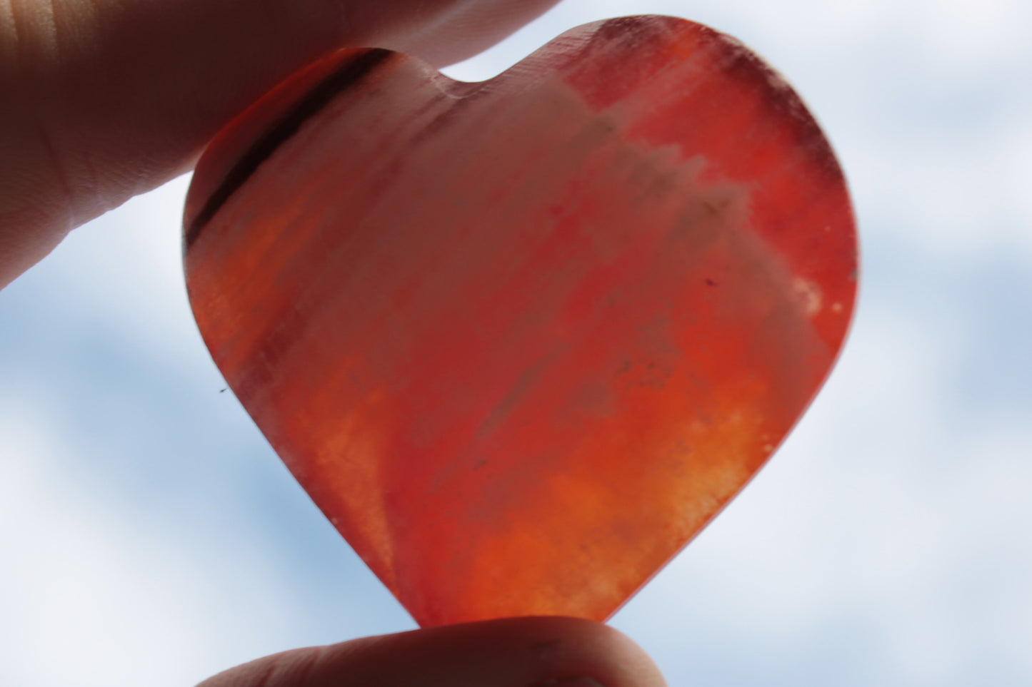 Orange Calcite hand-carved heart 57g Rocks and Things