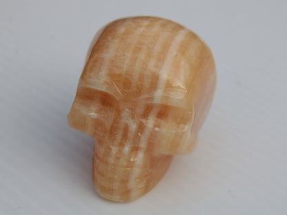 Banded Yellow Calcite skull 49mm 185.6g Rocks and Things