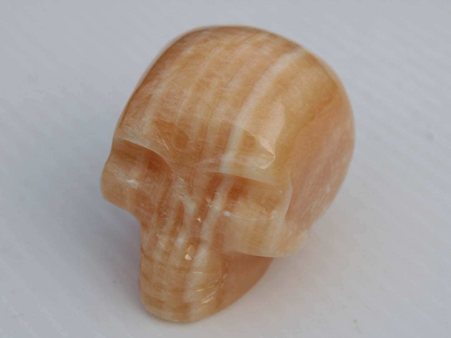 Banded Yellow Calcite skull 49mm 185.6g Rocks and Things