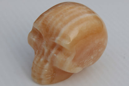 Banded Yellow Calcite skull 49mm 185.6g Rocks and Things