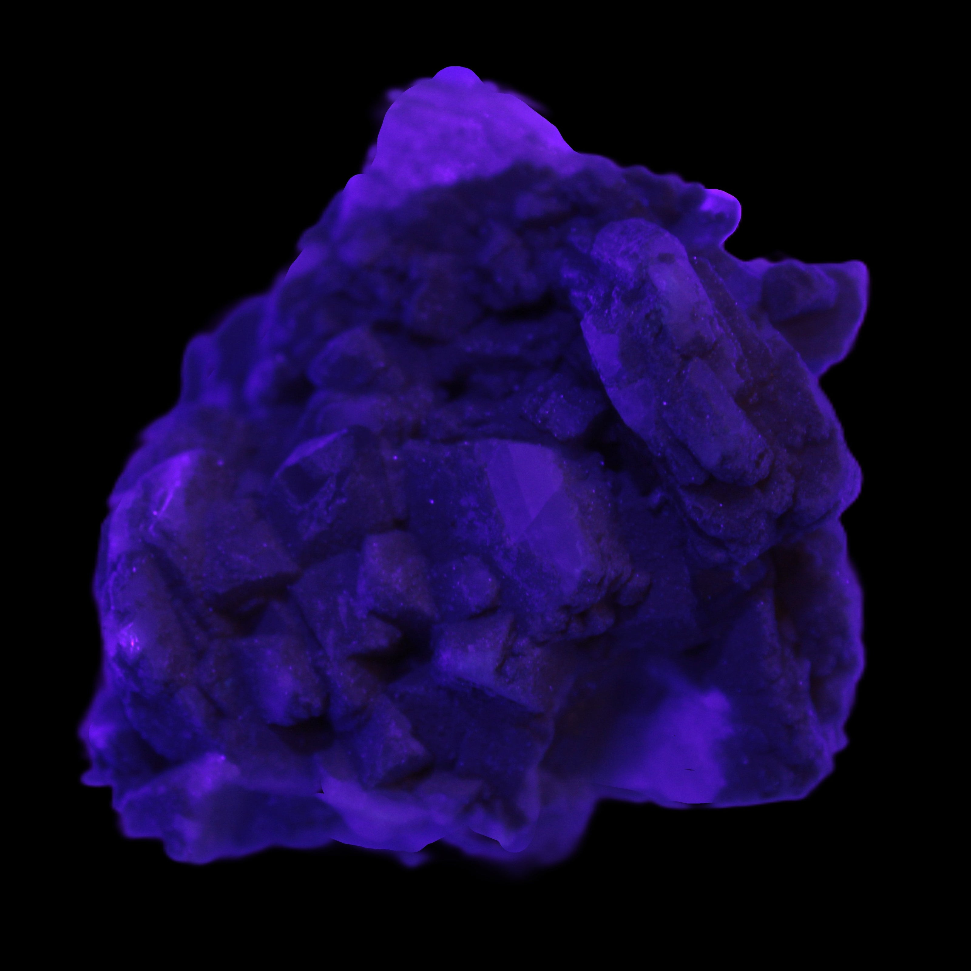 Amphitheatre Feldspar matrix with Mica and Clear Aquamarine and Quartz crystals 65g in UV light