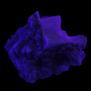 Amphitheatre Feldspar matrix with Mica and Clear Aquamarine and Quartz crystals 65g in UV light