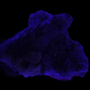 Elestial Smoky & Clear Quartz crystals with Calcite & Elbaite 99.3g in UV light