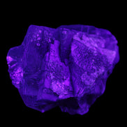 Blue Fluorite cubic cluster with Clear Calcite 168.8g in UV light - Rocks and Things Store