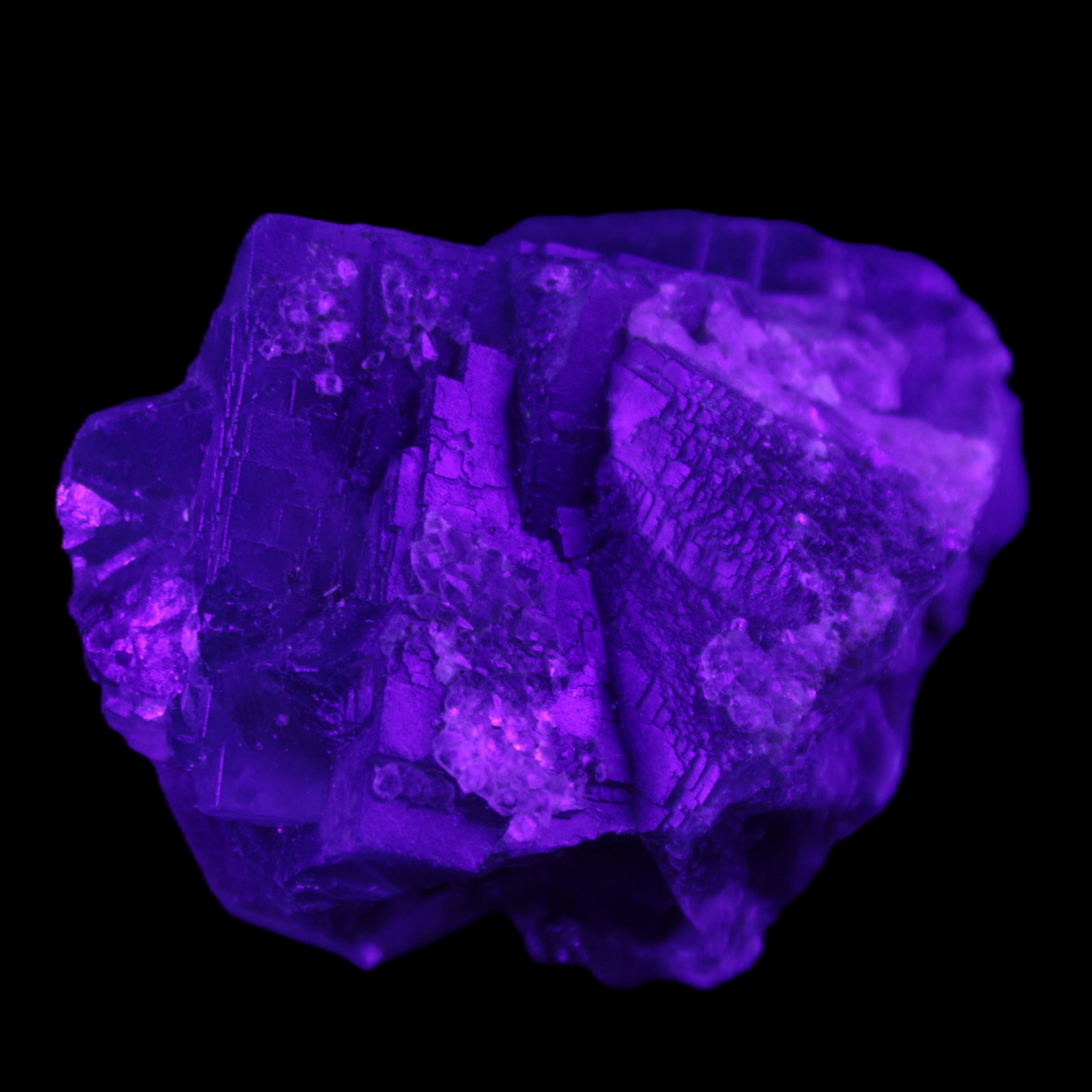 Blue Fluorite cubic cluster with Clear Calcite 168.8g in UV light - Rocks and Things Store