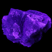 Blue Fluorite cubic cluster with Clear Calcite 168.8g in UV light - Rocks and Things Store