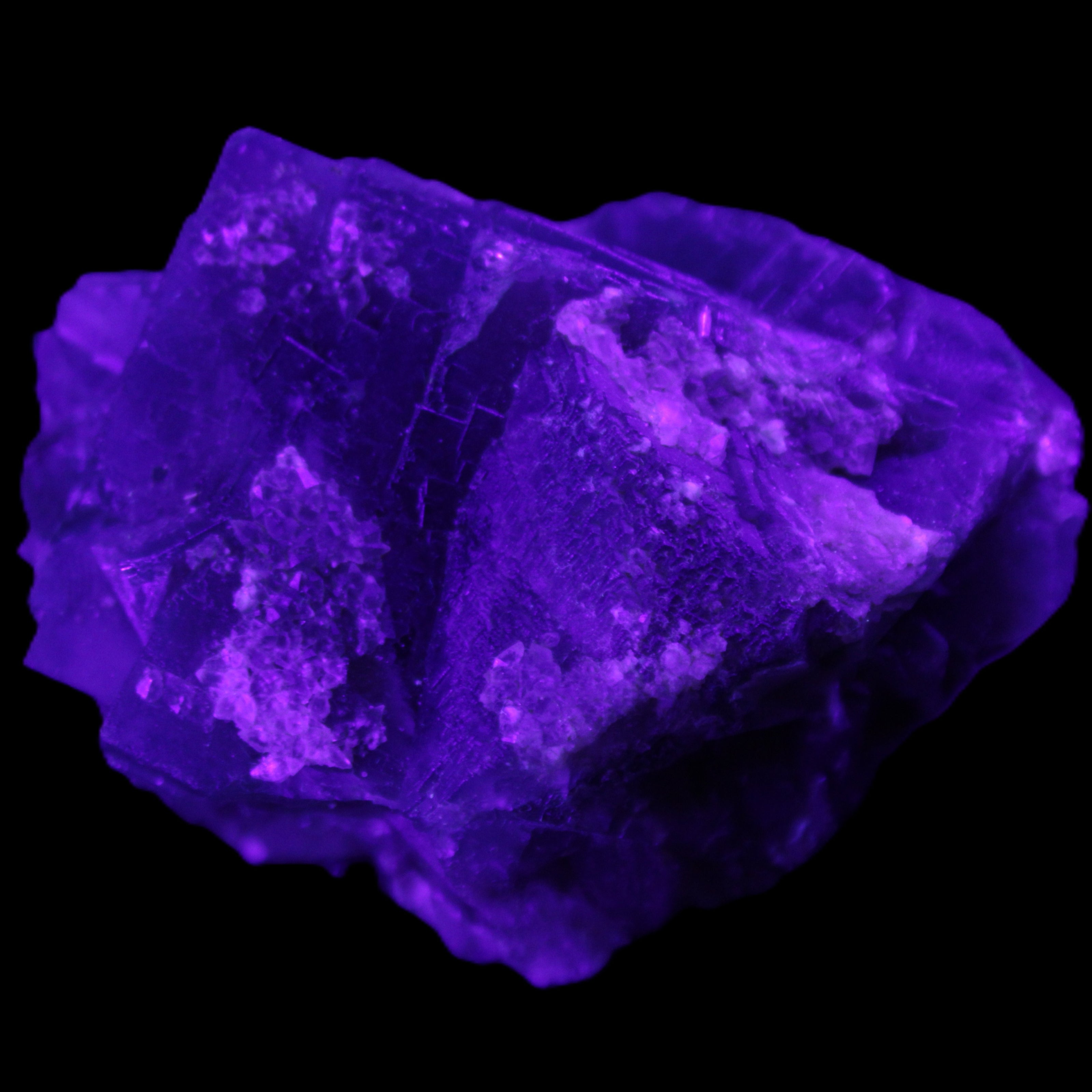 Blue Fluorite cubic cluster with Clear Calcite 168.8g in UV light - Rocks and Things Store