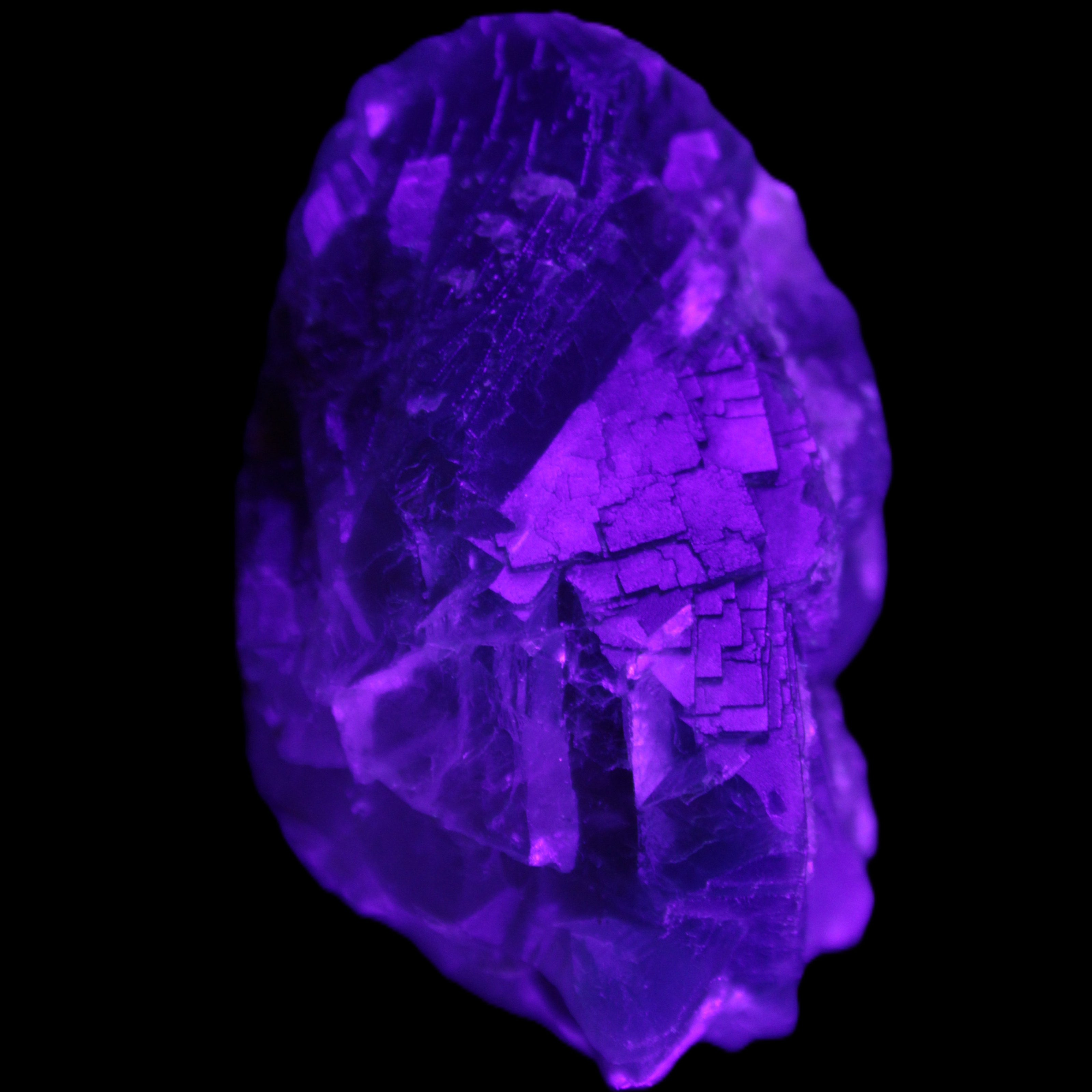 Blue Fluorite cubic cluster with Clear Calcite 168.8g in UV light - Rocks and Things Store