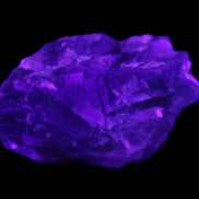 Blue Fluorite cubic cluster with Clear Calcite 168.8g in UV light - Rocks and Things Store