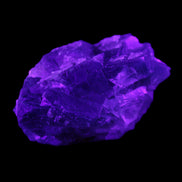 Blue Fluorite cubic cluster with Clear Calcite 168.8g in UV light - Rocks and Things Store