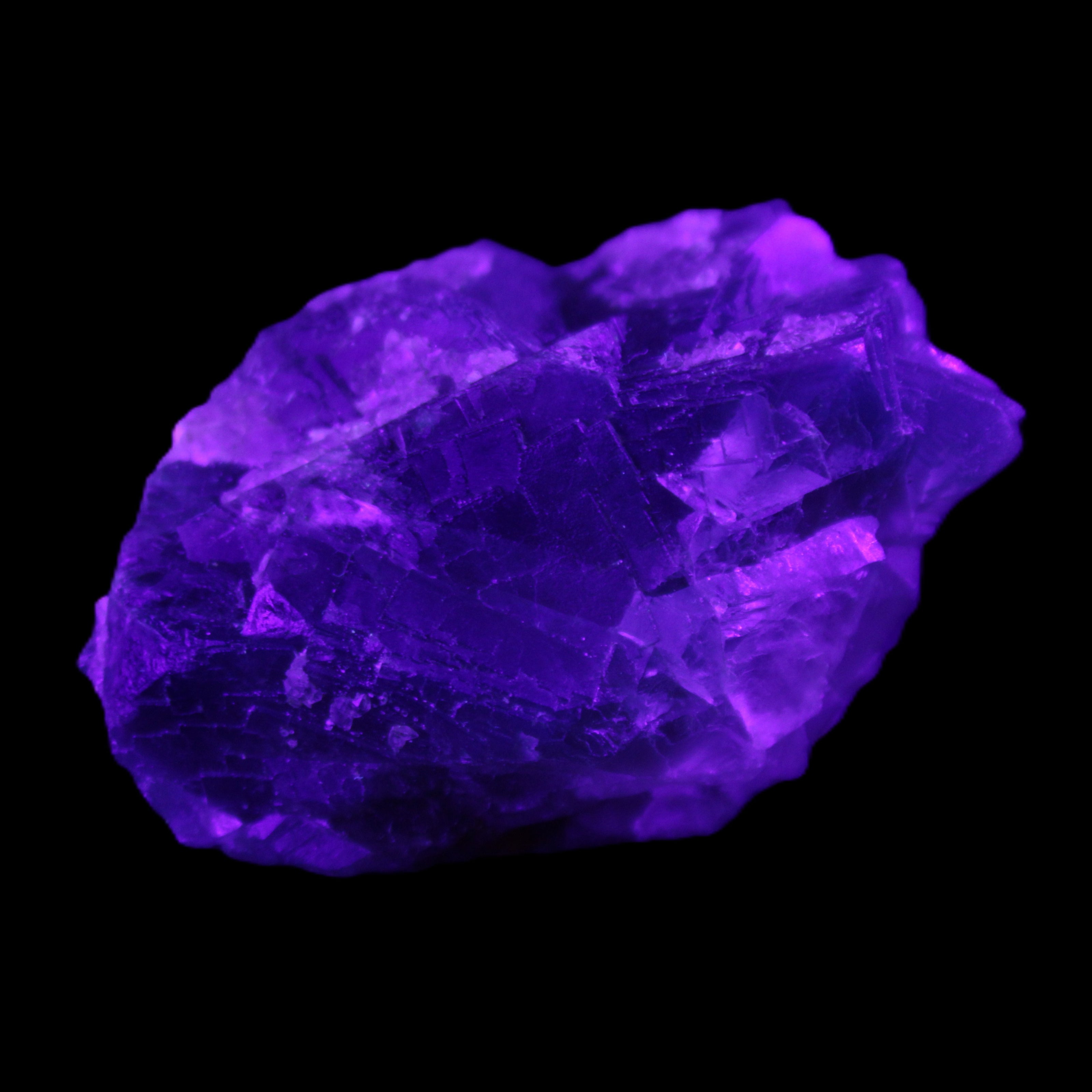 Blue Fluorite cubic cluster with Clear Calcite 168.8g in UV light - Rocks and Things Store