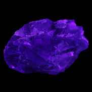 Blue Fluorite cubic cluster with Clear Calcite 168.8g in UV light - Rocks and Things Store