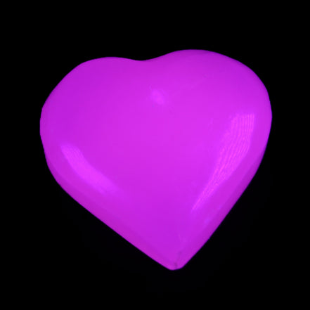 Mangano Calcite hand-carved heart 20-29g in UV light - Rocks and Things Store