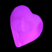 Mangano Calcite hand-carved heart 20-29g in UV light - Rocks and Things Store