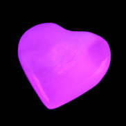 Mangano Calcite hand-carved heart 20-29g in UV light - Rocks and Things Store