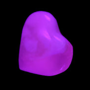 Mangano Calcite hand-carved heart 20-29g in UV light - Rocks and Things Store