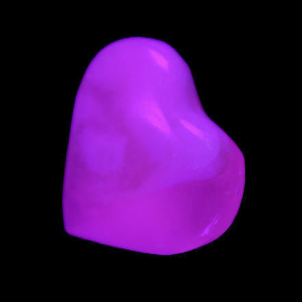 Mangano Calcite hand-carved heart 20-29g in UV light - Rocks and Things Store
