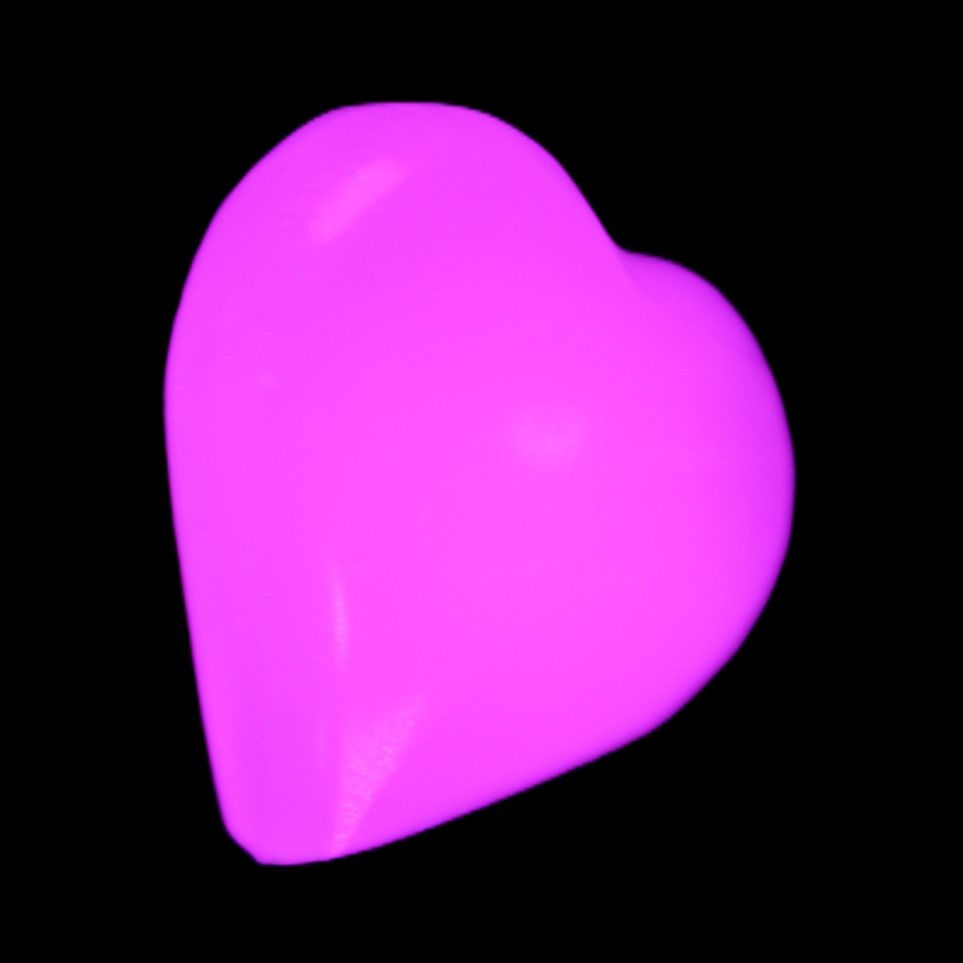Mangano Calcite hand-carved heart 20-29g in UV light - Rocks and Things Store