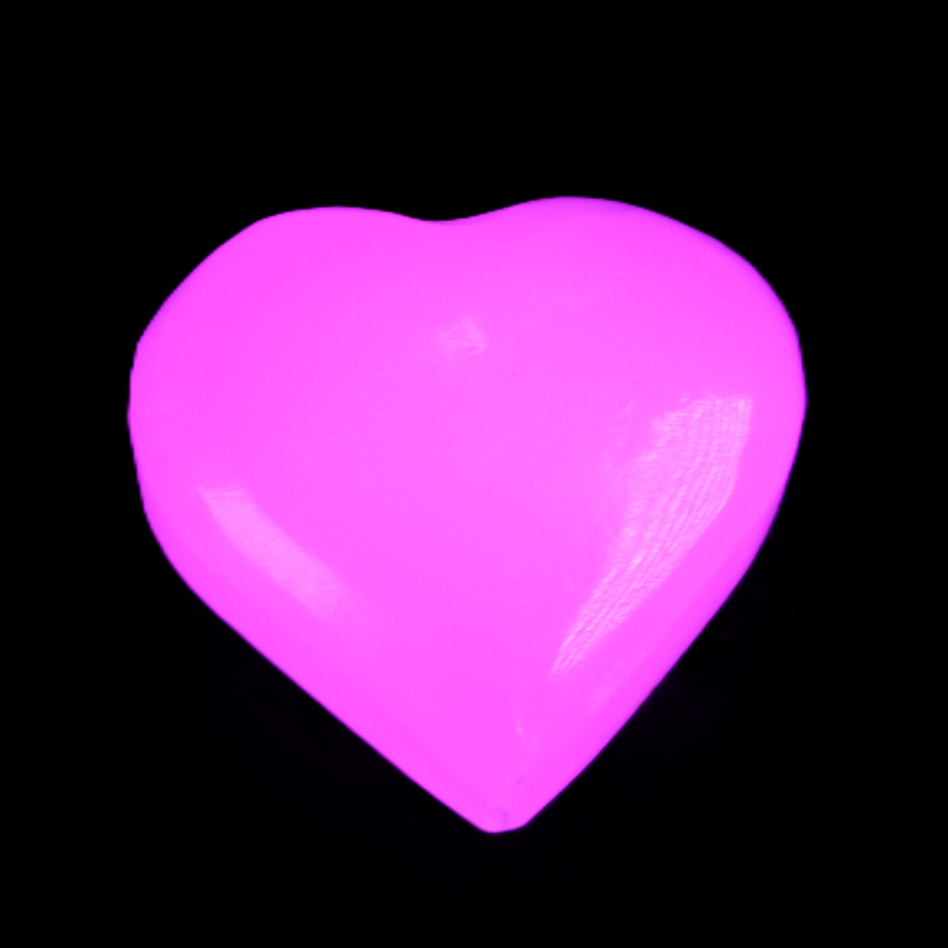 Mangano Calcite hand-carved heart 20-29g in UV light - Rocks and Things Store