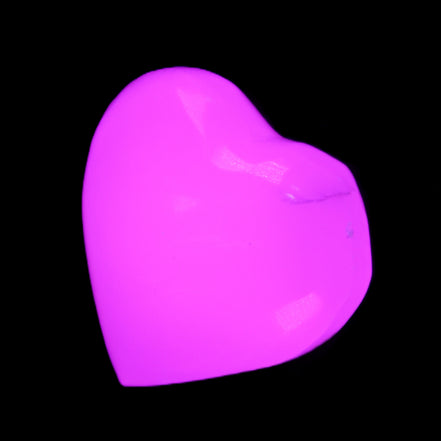 Mangano Calcite hand-carved heart 20-29g in UV light - Rocks and Things Store