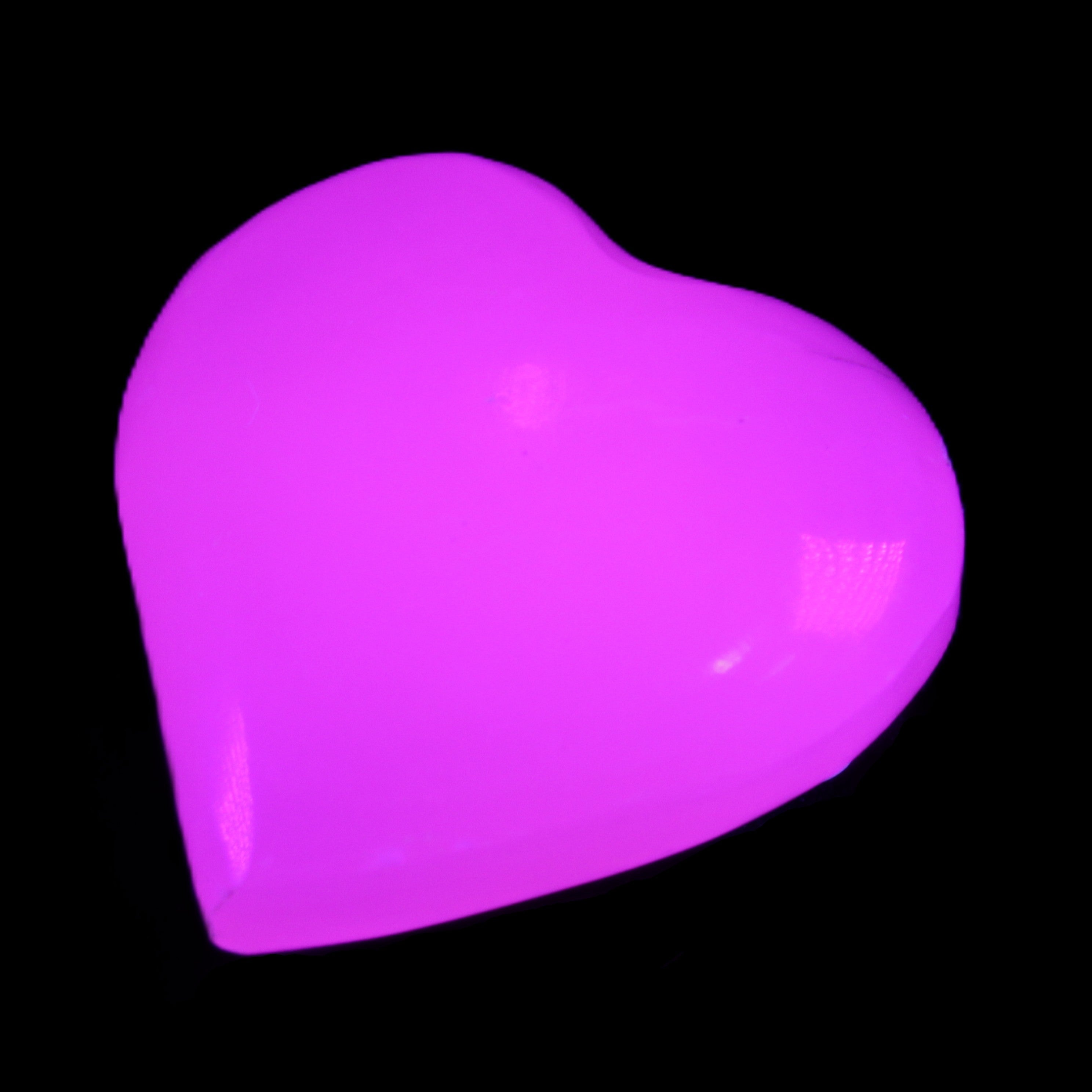 Mangano Calcite hand-carved heart 20-29g in UV light - Rocks and Things Store