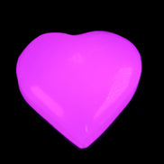 Mangano Calcite hand-carved heart 20-29g in UV light - Rocks and Things Store