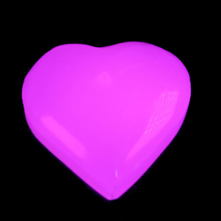 Mangano Calcite hand-carved heart 20-29g in UV light - Rocks and Things Store