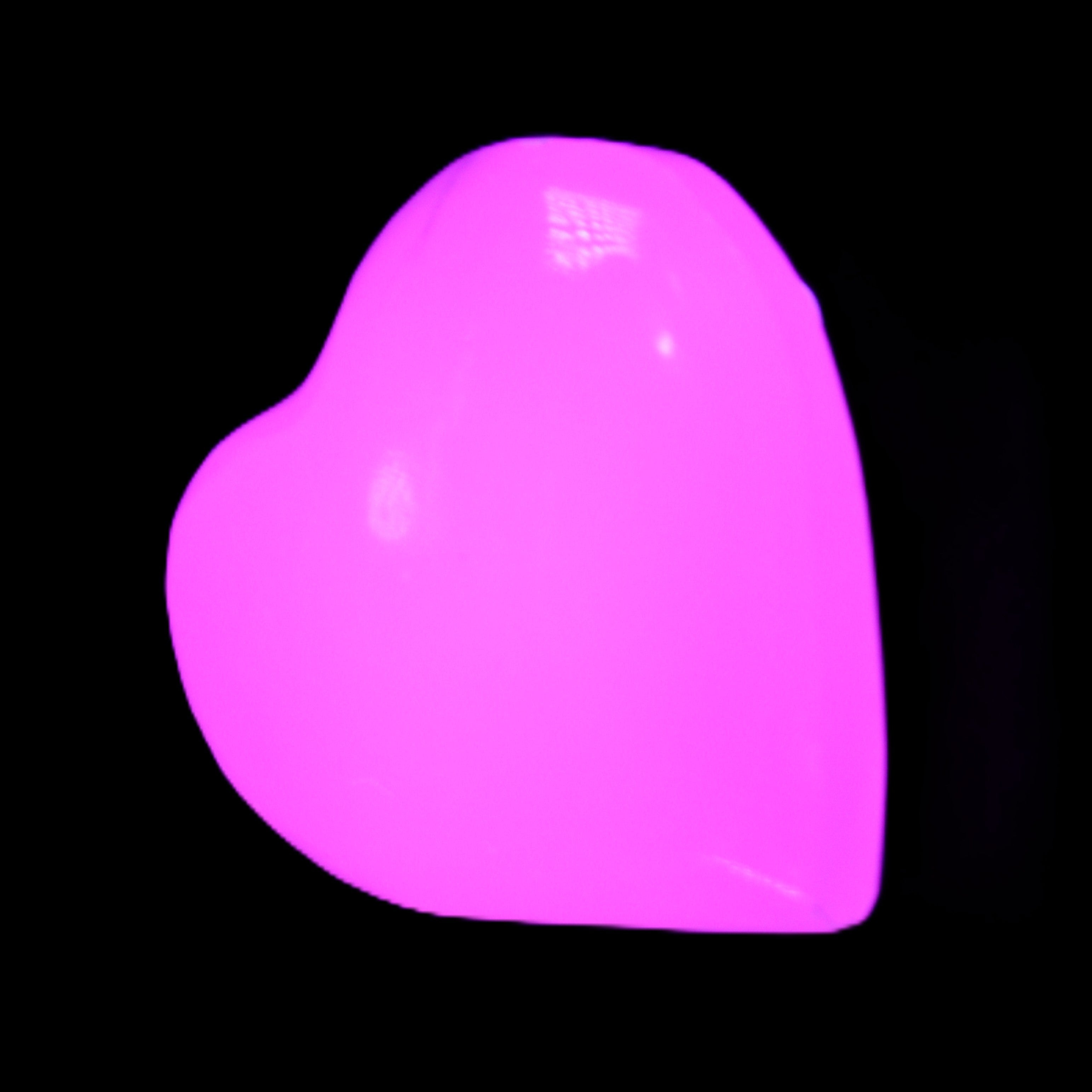 Mangano Calcite hand-carved heart 20-29g in UV light - Rocks and Things Store