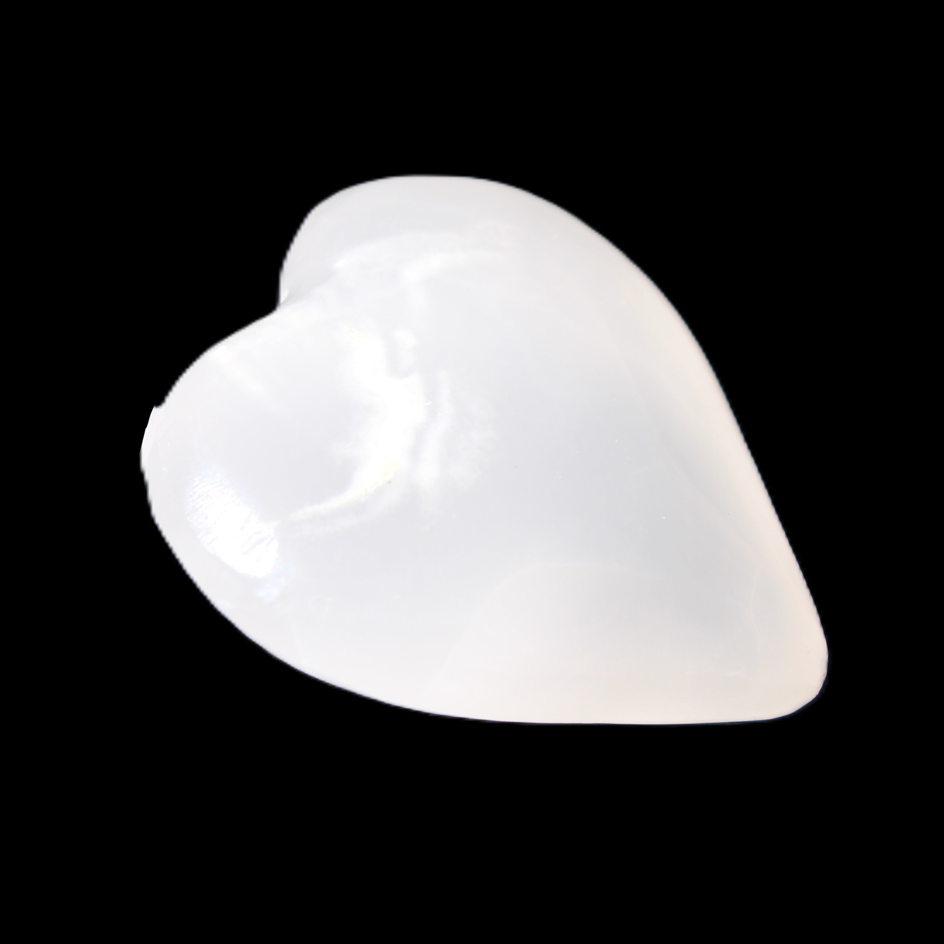 Mangano Calcite hand-carved heart 20-29g in sunlight - Rocks and Things Store
