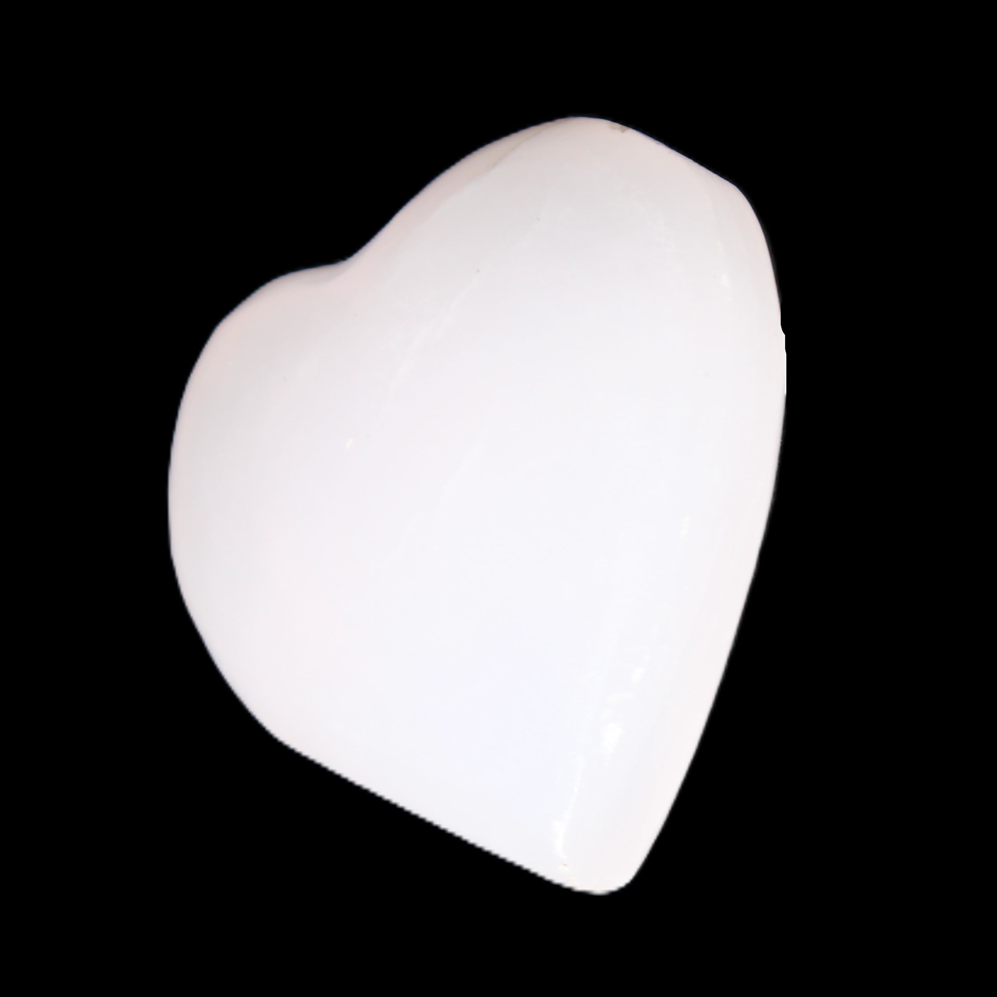 Mangano Calcite hand-carved heart 20-29g in sunlight - Rocks and Things Store