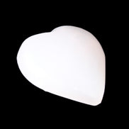 Mangano Calcite hand-carved heart 20-29g in sunlight - Rocks and Things Store