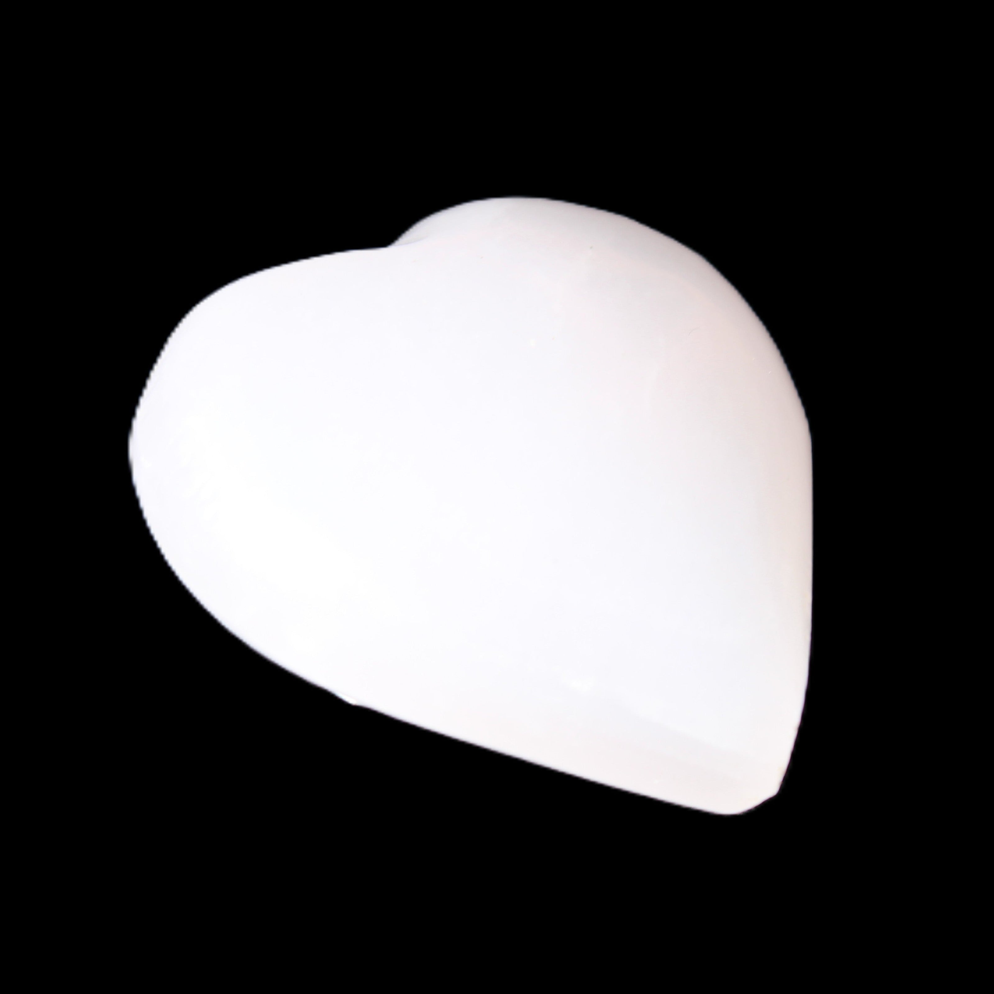 Mangano Calcite hand-carved heart 20-29g in sunlight - Rocks and Things Store