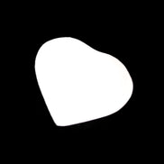 Mangano Calcite hand-carved heart 20-29g in sunlight - Rocks and Things Store
