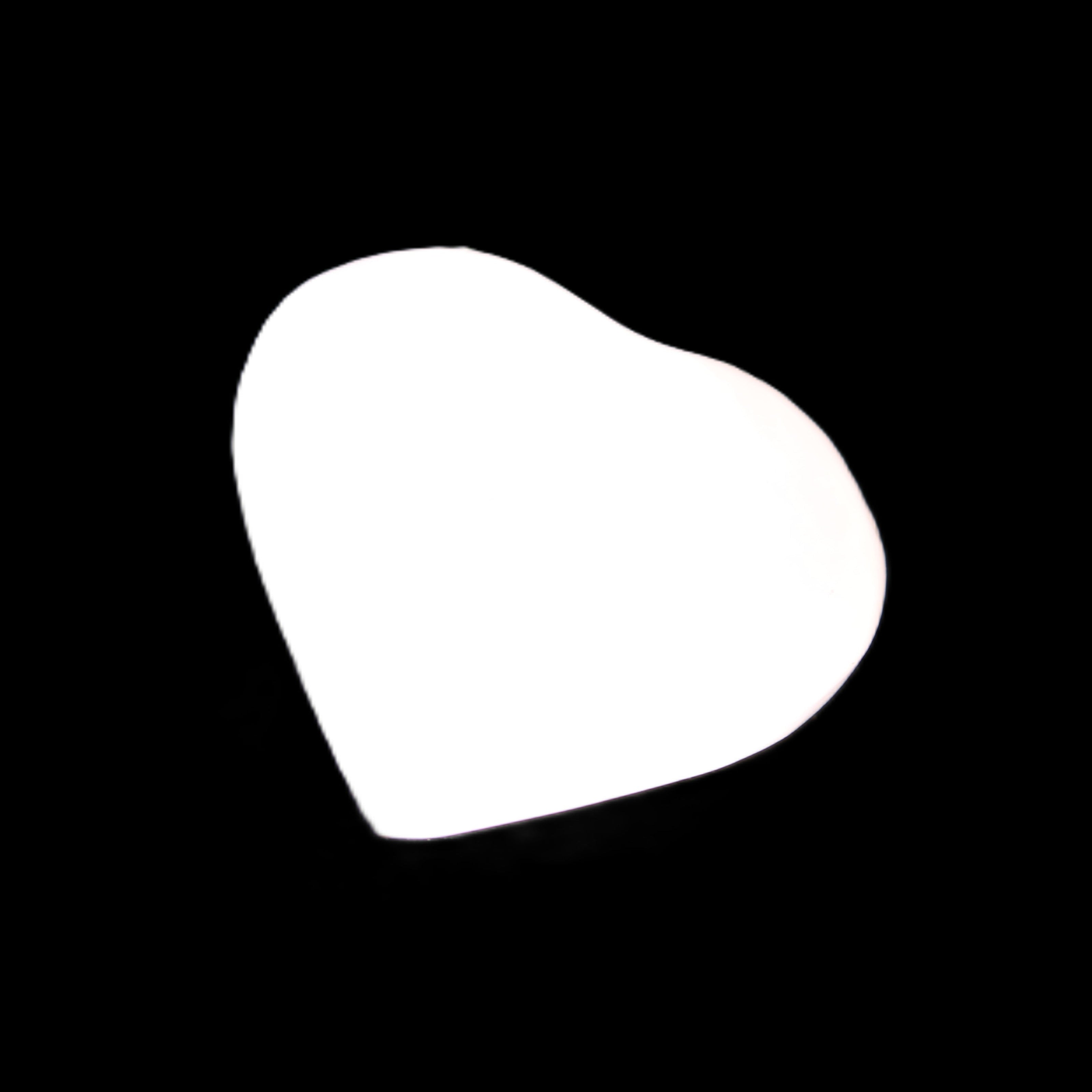 Mangano Calcite hand-carved heart 20-29g in sunlight - Rocks and Things Store
