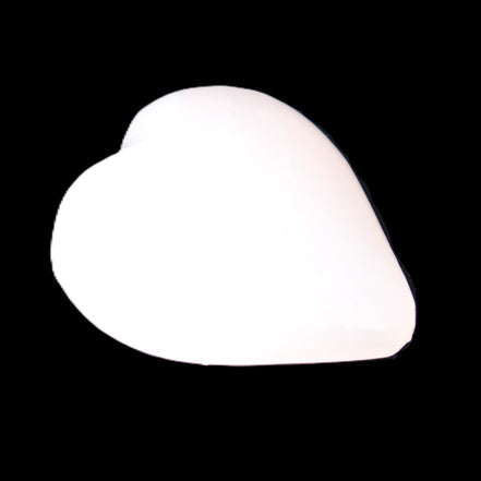 Mangano Calcite hand-carved heart 20-29g in sunlight - Rocks and Things Store