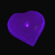 Mangano Calcite hand-carved heart 30-39g in UV light - Rocks and Things Store