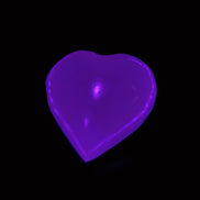 Mangano Calcite hand-carved heart 30-39g in UV light - Rocks and Things Store