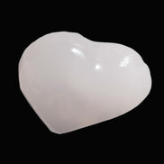Mangano Calcite hand-carved heart 30-39g in sunlight - Rocks and Things Store