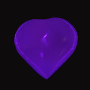 Mangano Calcite hand-carved heart 40-49g in UV light - Rocks and Things Store