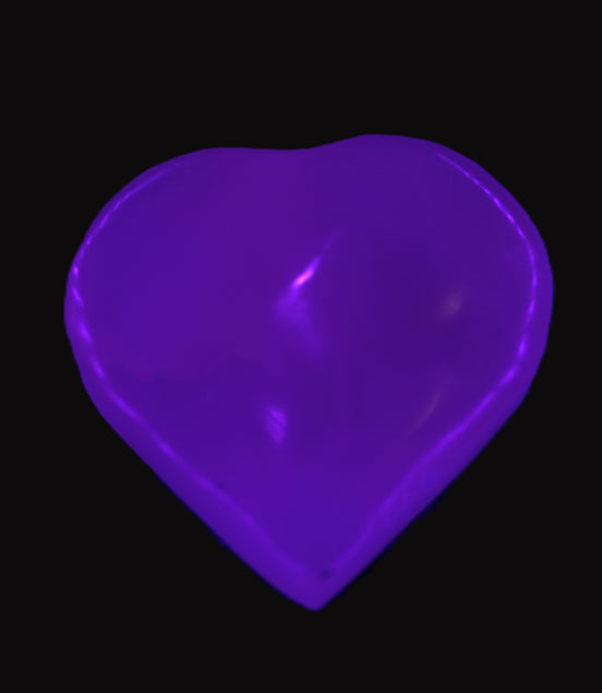 Mangano Calcite hand-carved heart 40-49g in UV light - Rocks and Things Store