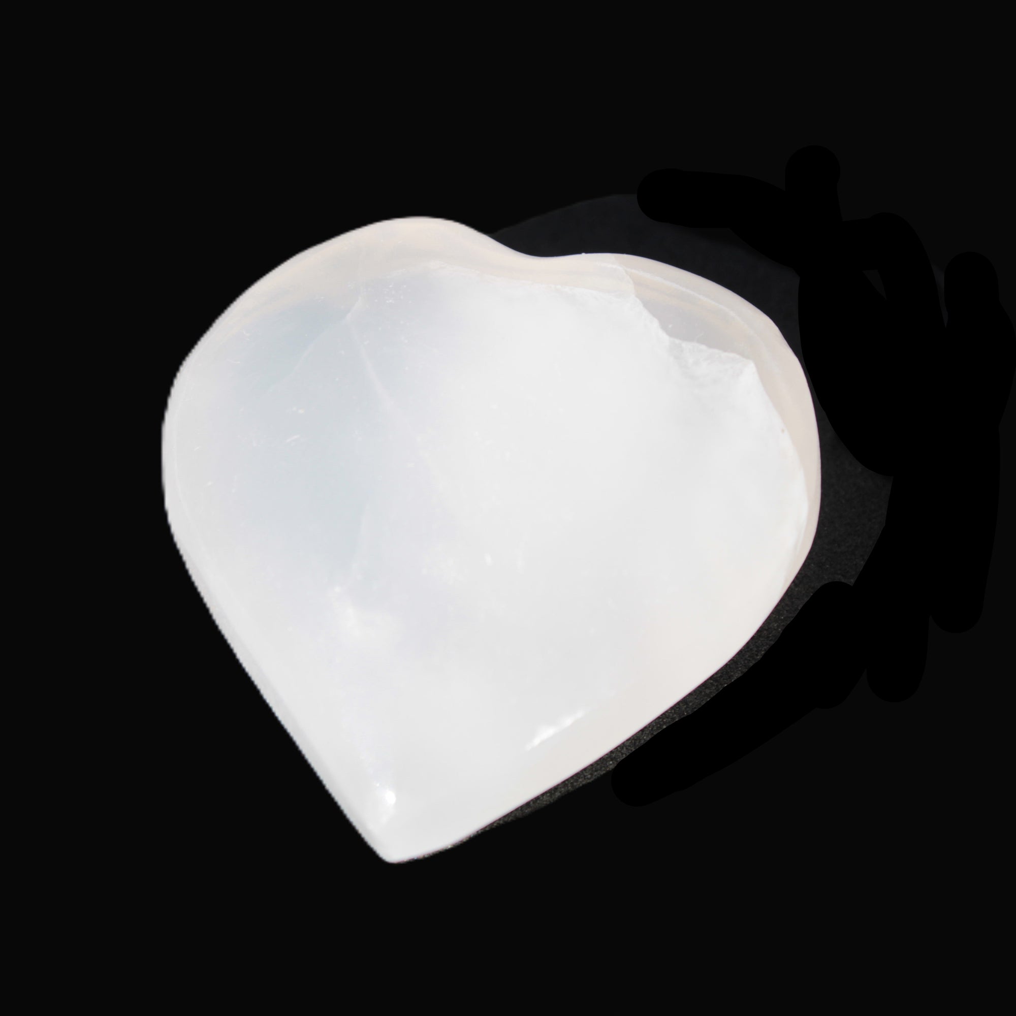 Mangano Calcite hand-carved heart 40-49g in sunlight - Rocks and Things Store